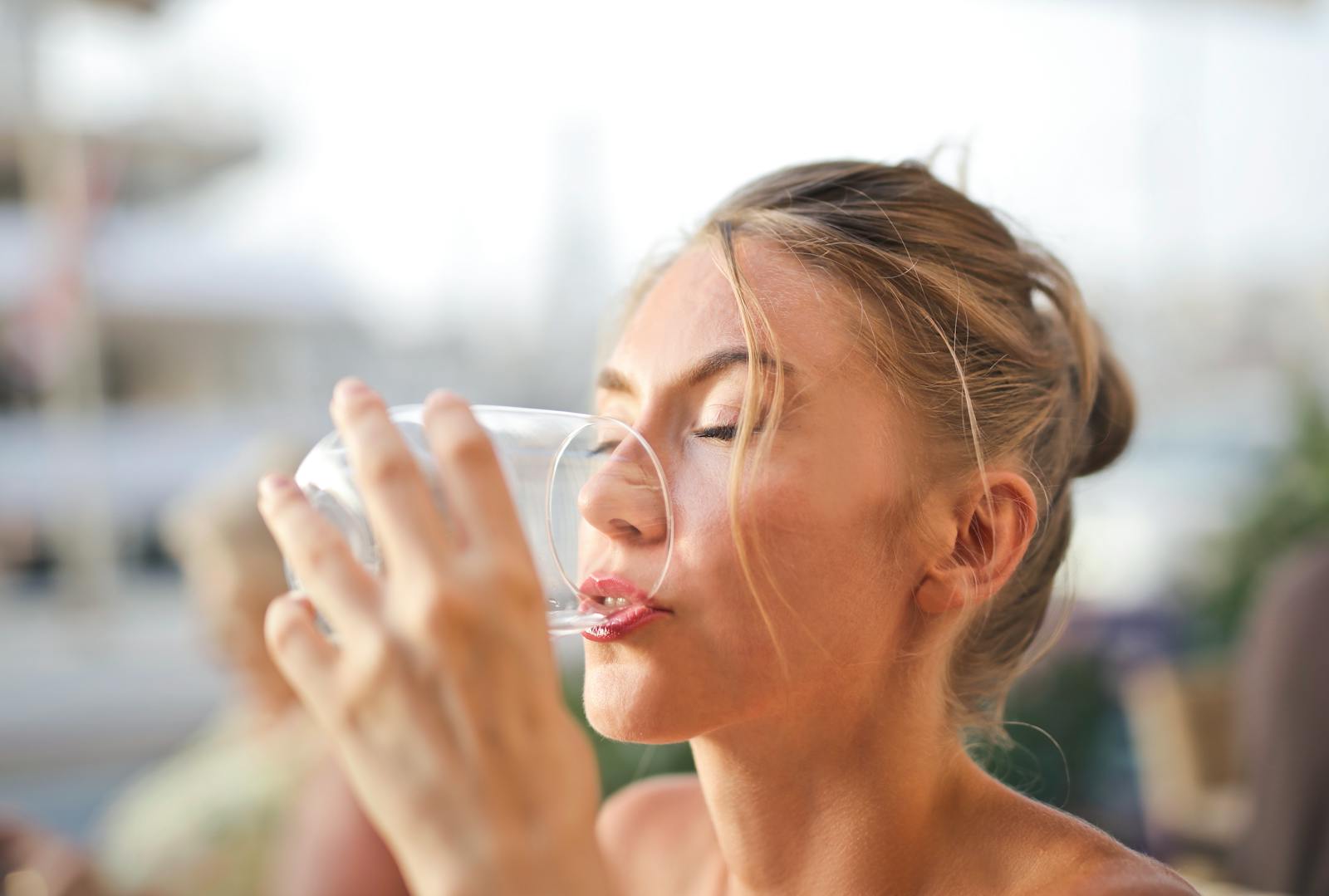 20 Reasons Why You Should Drink Plenty of Water Every Day 1 Woman Drinking from Glass