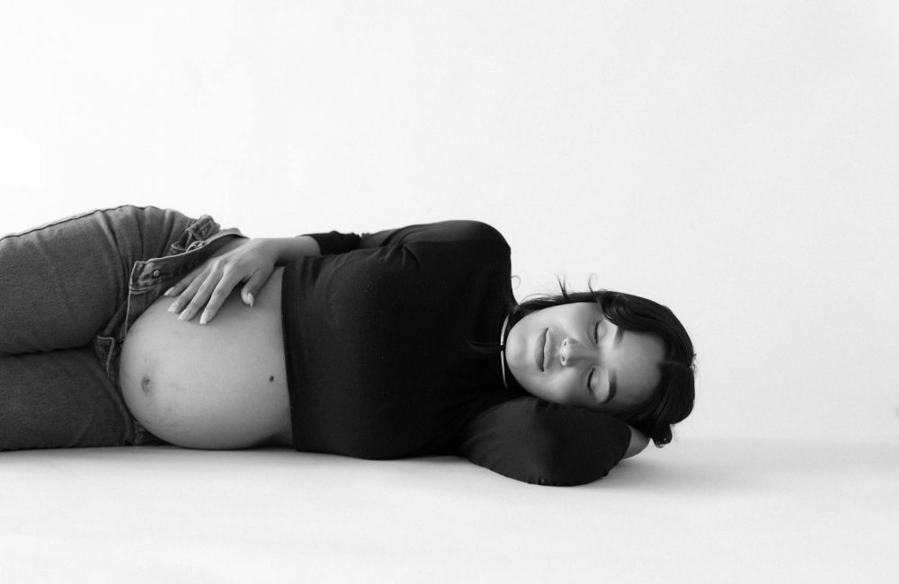 Pregnant Woman Lying Down with Eyes Closed