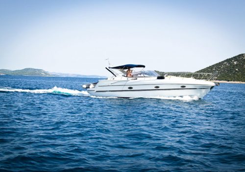 White Speedboat on Body of Water