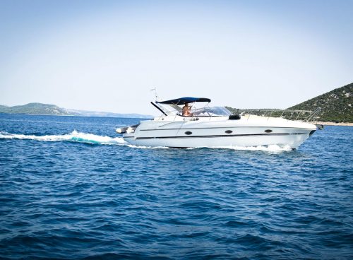 White Speedboat on Body of Water