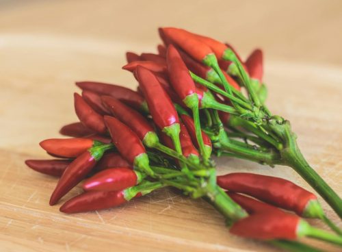 Red Chili Peppers on Brown Wooden Surface
