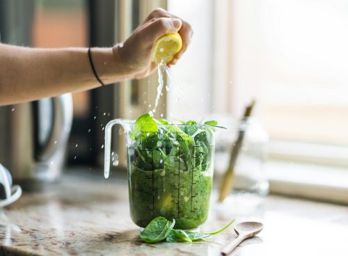 person squeezing lemon