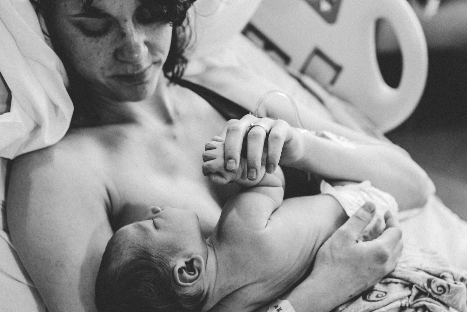 15 Effective Ways for Mothers to Lose the Baby Weight After Giving Birth 1 Monochrome Photograph of a Woman Carrying an Infant