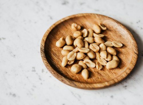 Brown Wooden Round Bowl With Brown Nuts