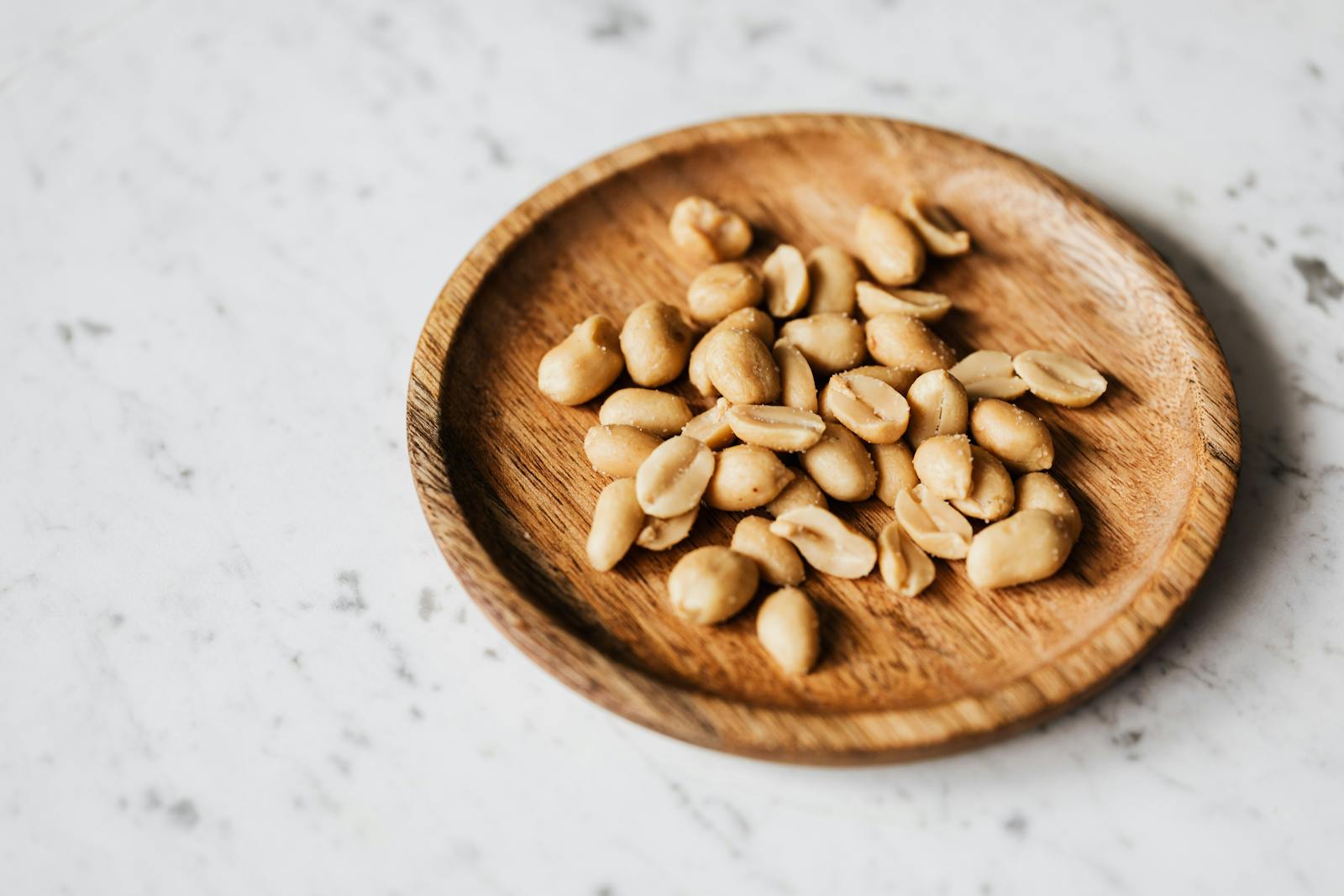 Brown Wooden Round Bowl With Brown Nuts