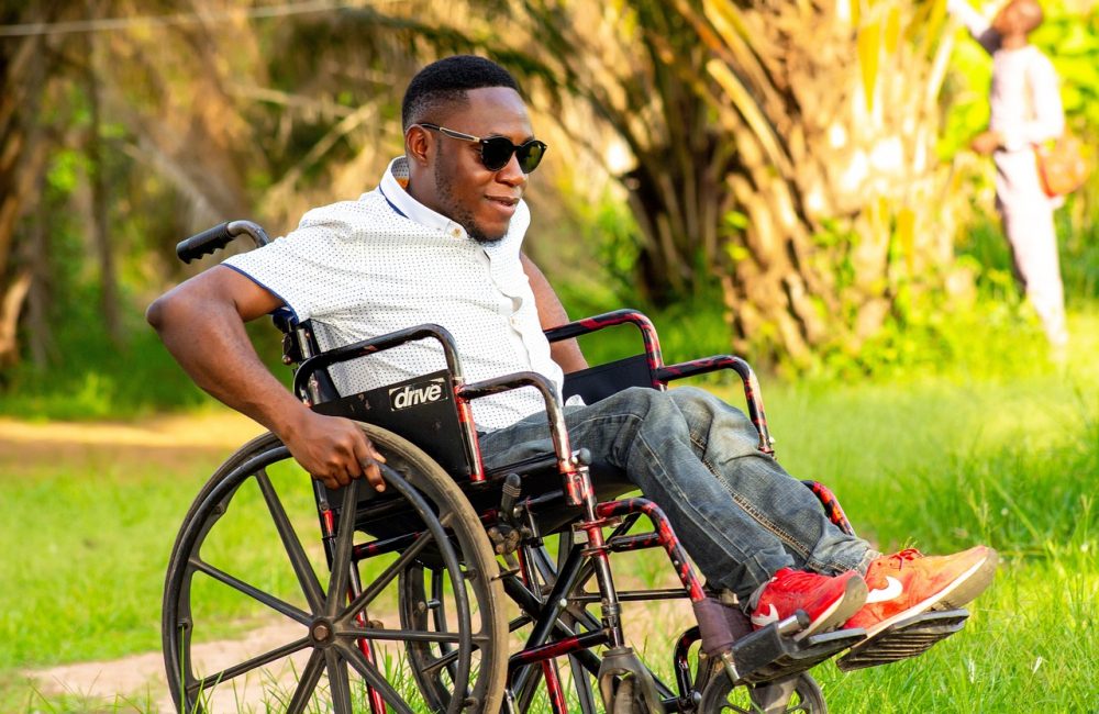 man on a wheelchair, wheelchair, push