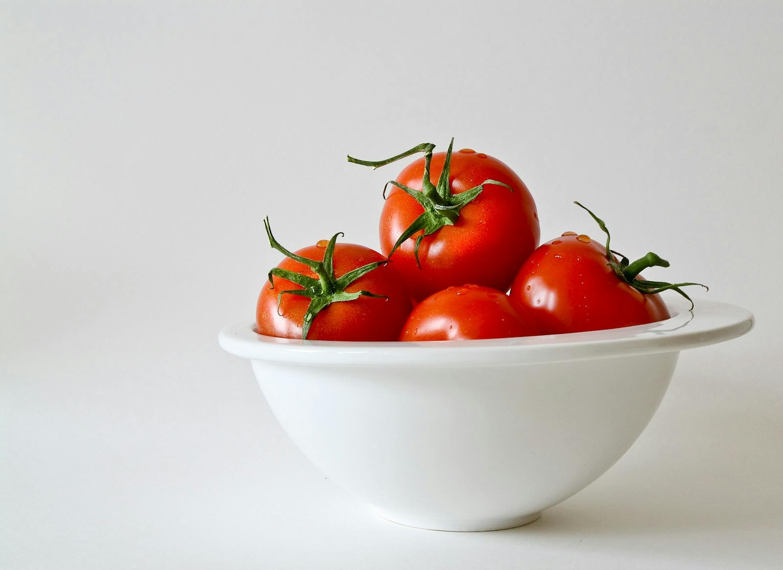 Red Tomatoes in White Bowl