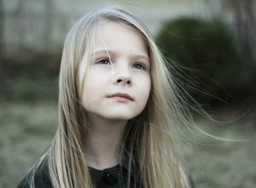 close-up photography of girl in black top during daytime