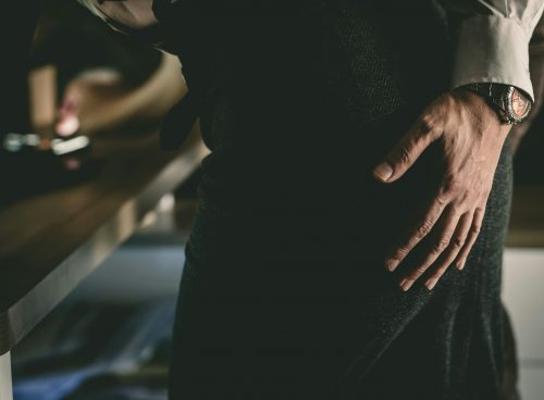 a person with their hands on their hips