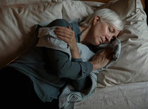 An Elderly Woman Lying on the Bed