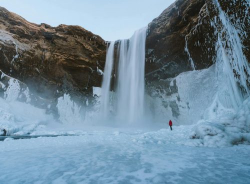 Person Walking on Snowfield