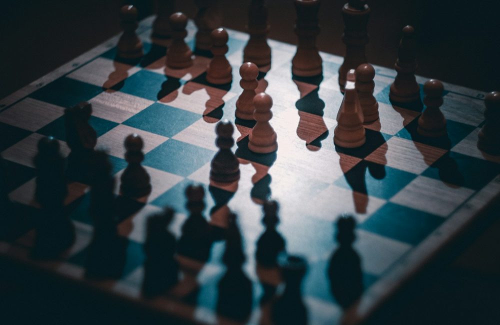 a chess board with a lot of chess pieces on it