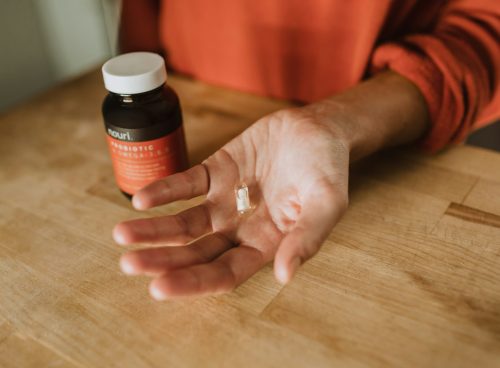 person holding medication pill