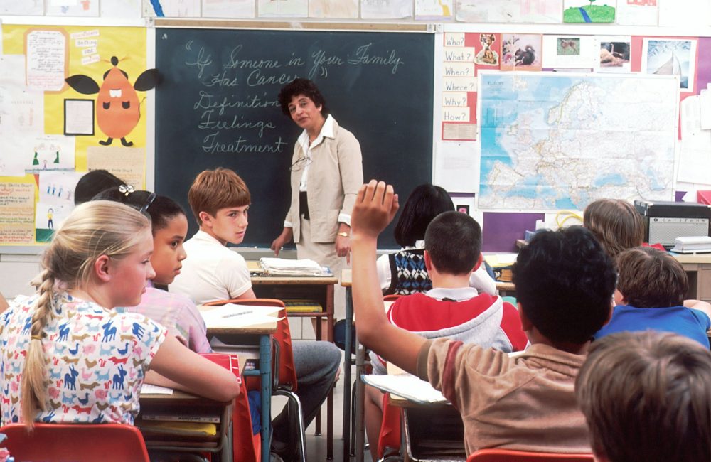 woman standing in front of children
