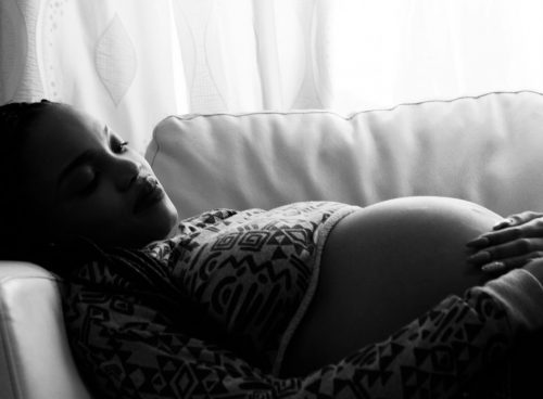pregnant woman lying on the sofa