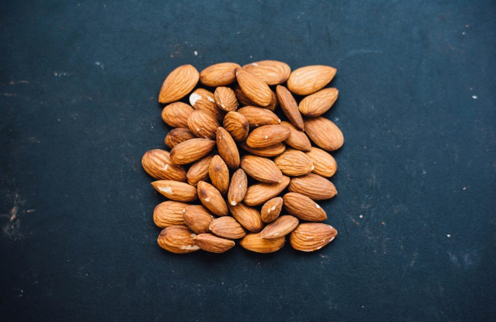 brown nuts on black surface