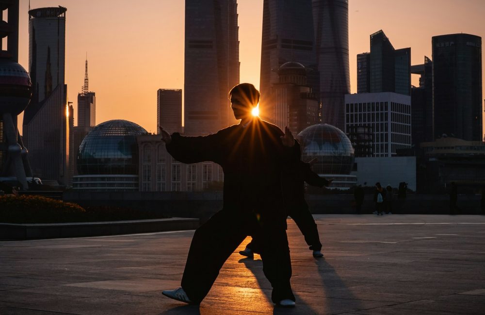 silhouette of man near buildings