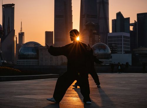 silhouette of man near buildings