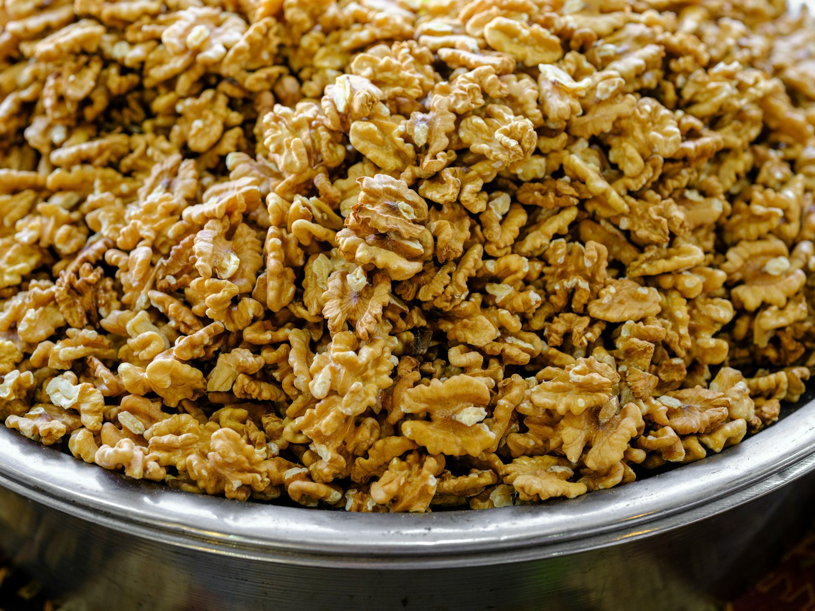 22 Foods That Can Help Improve Your Memory 1 a metal bowl filled with lots of nuts