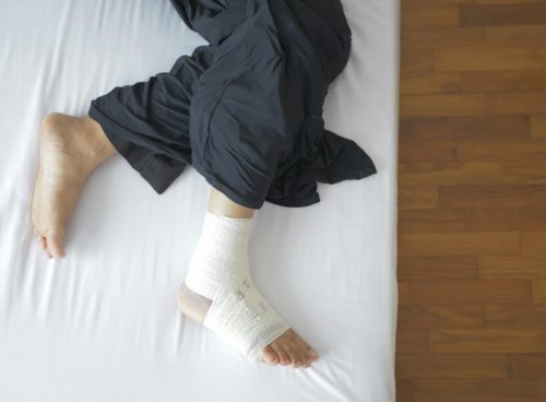 Man with Bandage on Foot