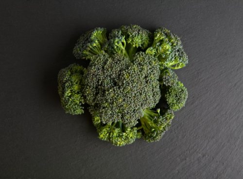 green broccoli on gray textile