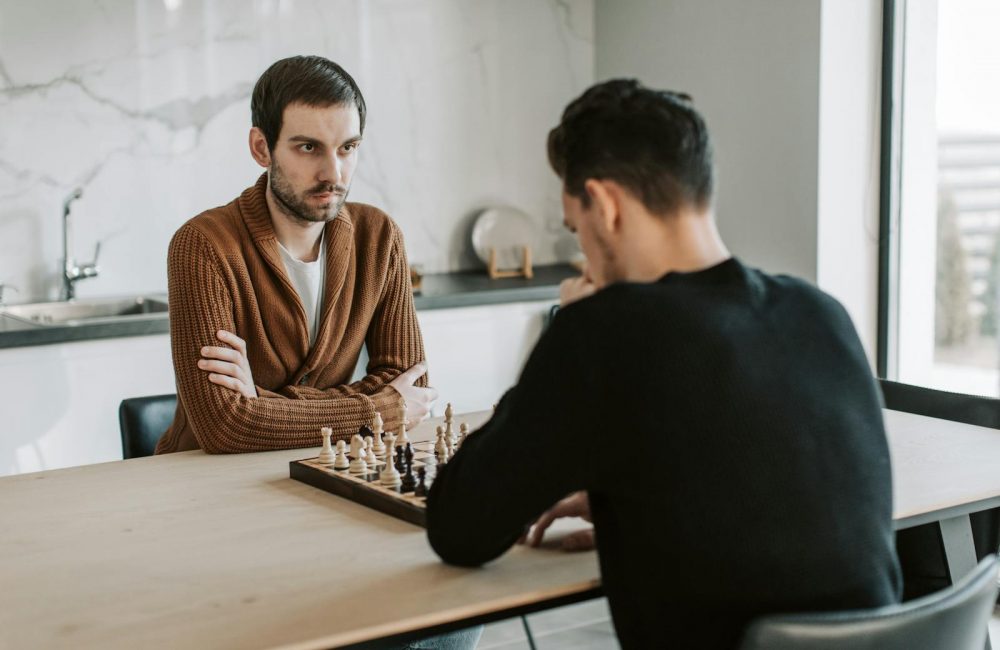 Men Playing Chess Together