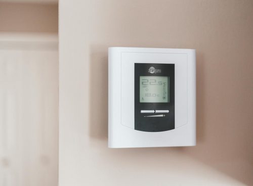 White Thermostat Hanging on the Wall