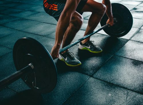 Person Holding Barbell