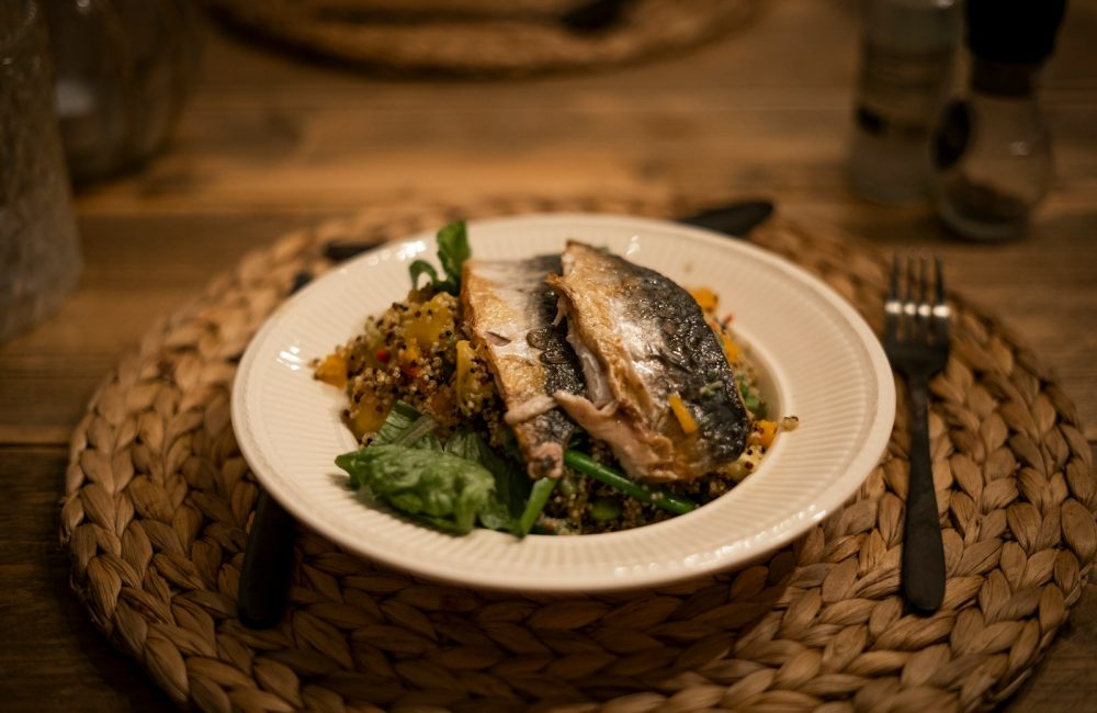 cooked fish on white ceramic plate