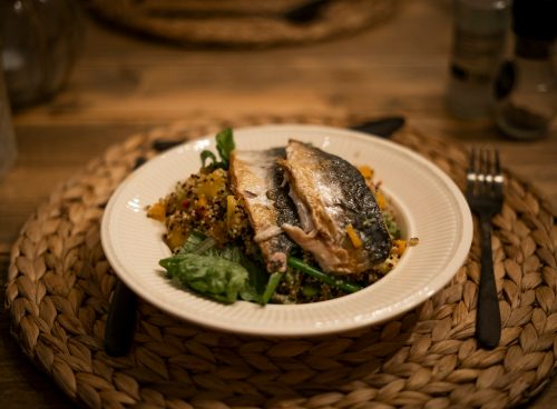 cooked fish on white ceramic plate
