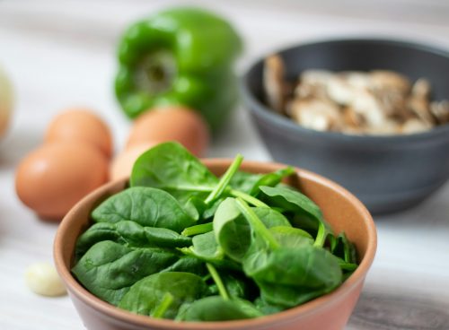 green vegetable on white ceramic bowl