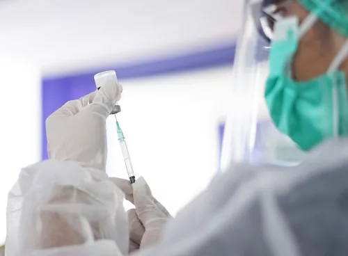 Doctor explaining anesthesia safety to patient before surgery