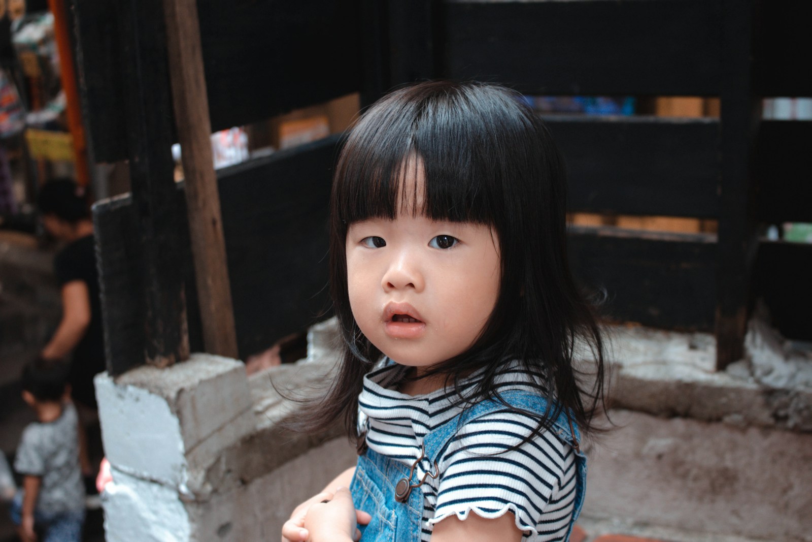 girl in black and white striped long sleeve shirt